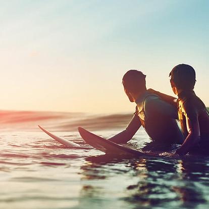 father and son surfing in puerto vallarta